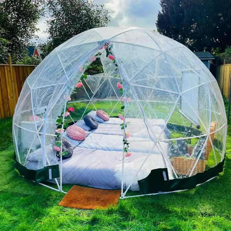 Transparent garden dome tent with geodesic frame for outdoor use